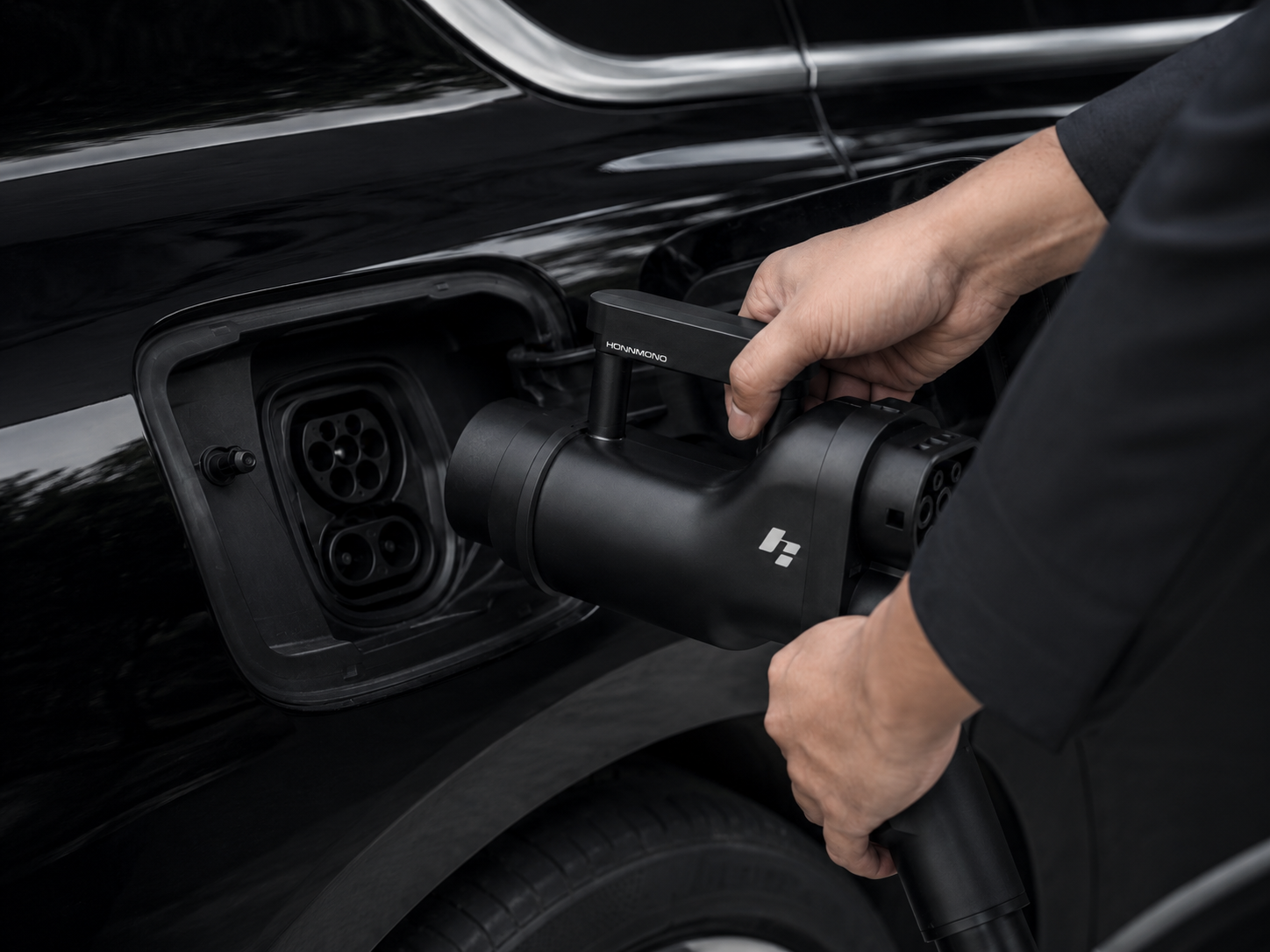 HONNMONO adapter being connected to an electric vehicle
